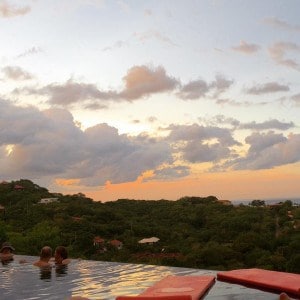 infinity pool with sunset